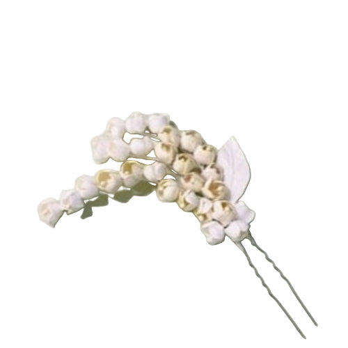 An ivory floral hair pin with delicate petals and a stem, displayed on a neutral background.