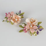 Pair of floral earrings with mix of pink, green, and purple colors 