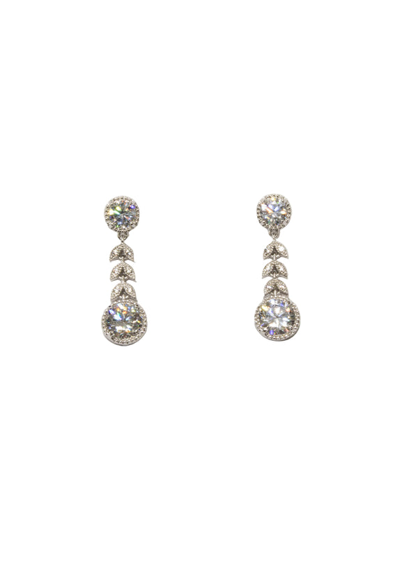 Pair of silver teardrop earrings with clear stones on a light background