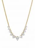 A gold tennis necklace with a graduated pattern of cubic zirconia stones.