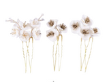 Six handmade ivory floral hairpins with gold-colored stems on a white background.