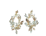 Pair of floral earrings arranged in a circular shape with blush and ivory petals and leaves