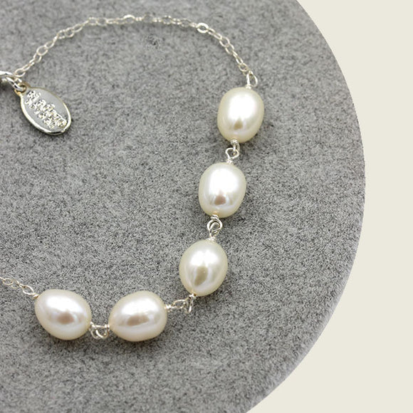 freshwater baroque pearls on a silver chain bracelet'