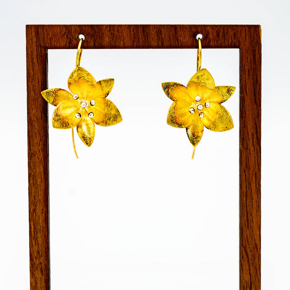 Single gold vermeil lotus flower petal blossoms with beautifully delicate silver pistils botanical earrings
