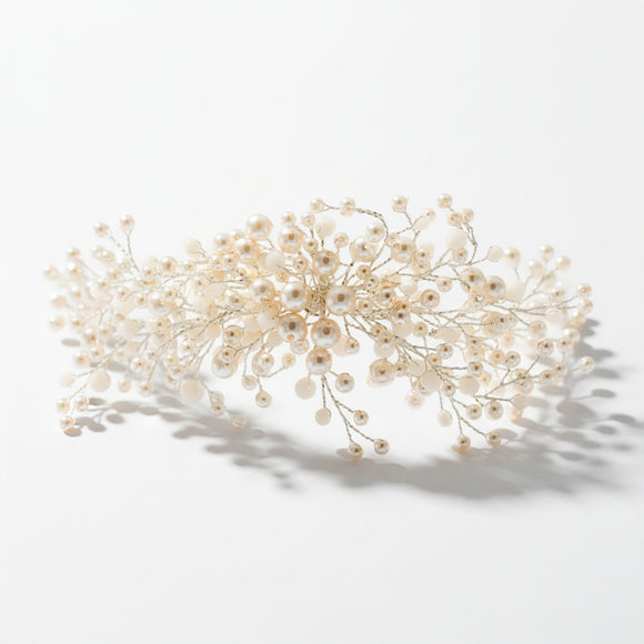 A beaded pearl hair clip with white beads.