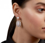 Baguette-cut Zirconia burst from a natural moonstone drop, dangling from a pearl post bridal earring