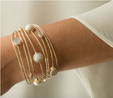 elegant 18kt gold plated demi-cuff with a collection of Moonstone, fresh water pearl, and Zirconia.elegant pearl and moonstone gold plated bridal bracelet 